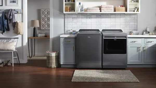 The Whirlpool WTW8127LC washer and WED8127LC dryer in a laundry room 