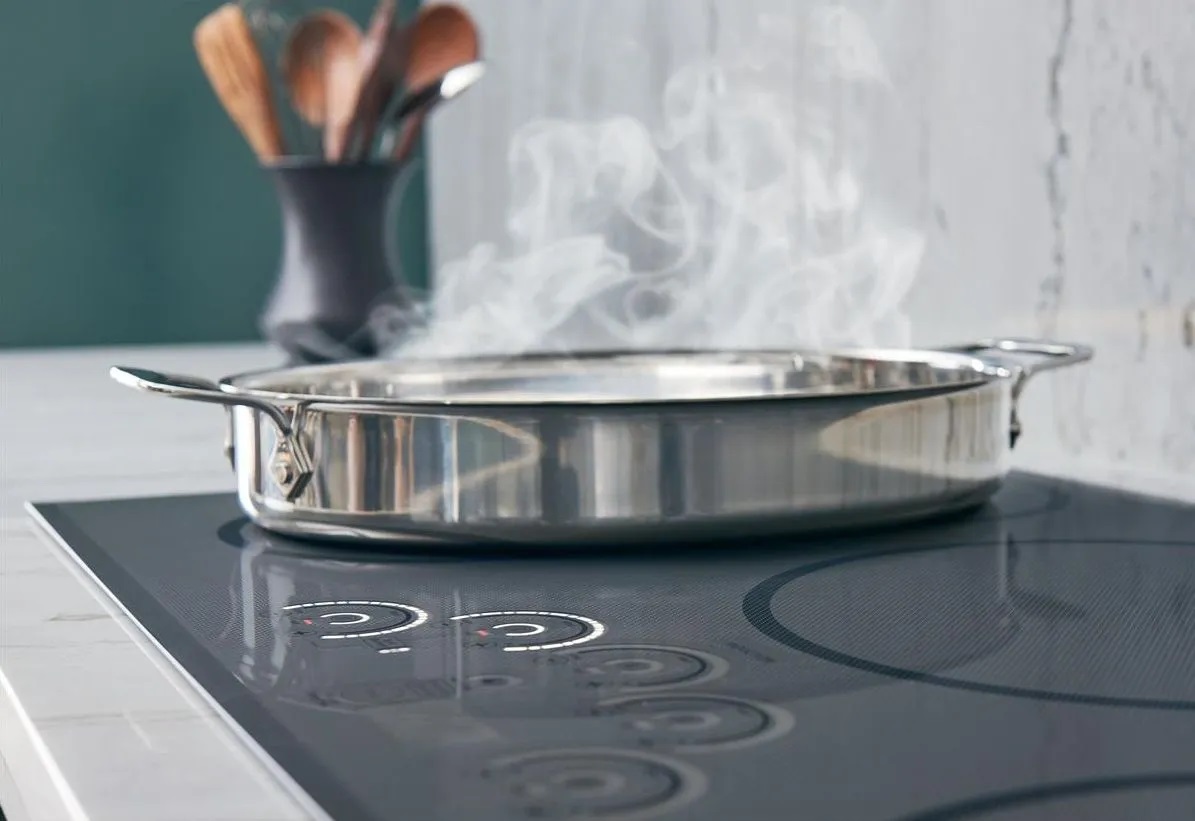 Café A wide cooking pot shown on a GE Café 30” induction cooktop