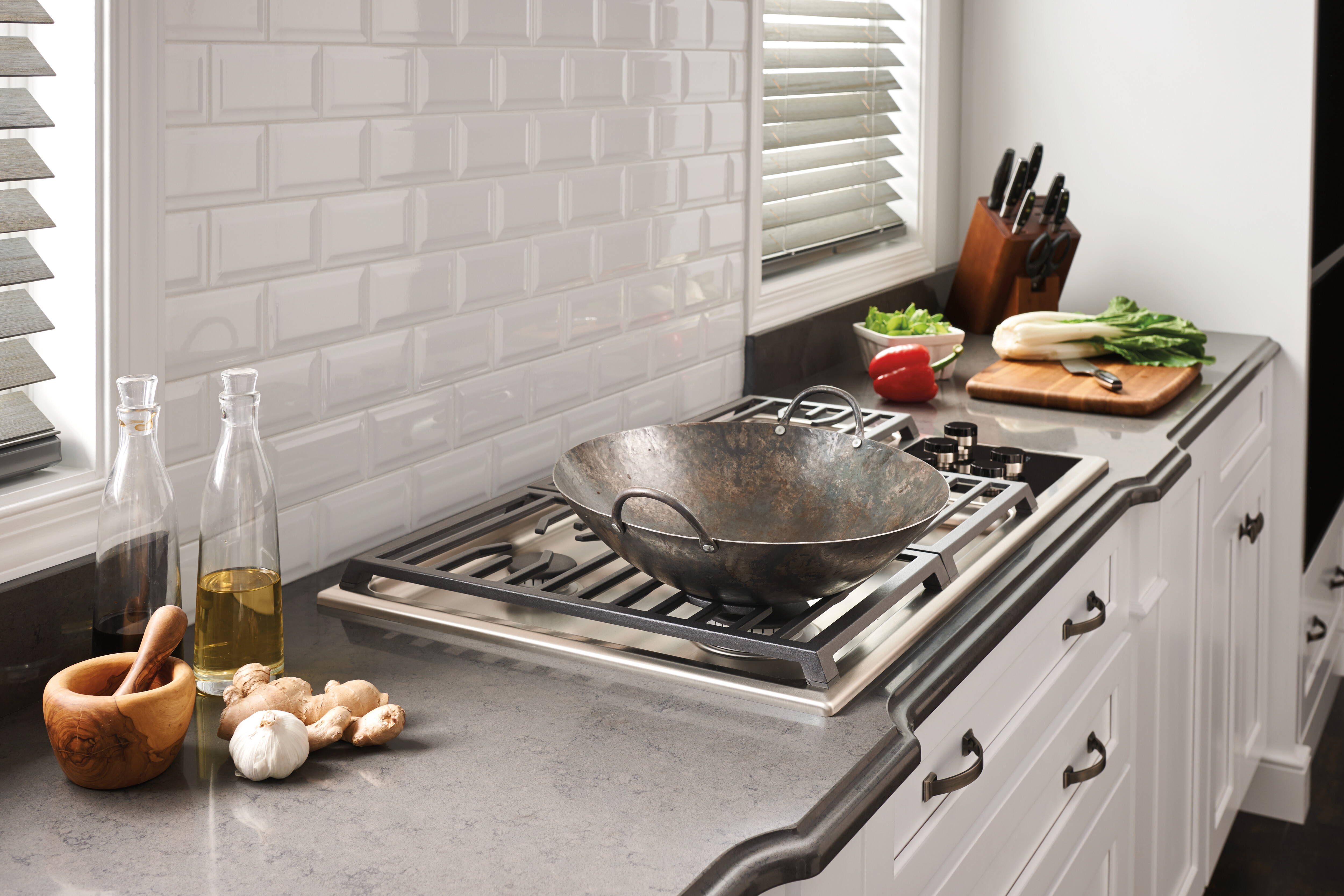 Wolf A wok grate on a Wolf gas cooktop