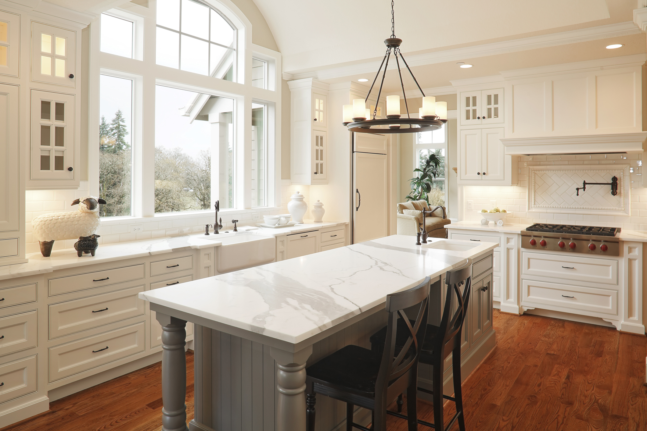 luxury kitchen with white cabinetry and a Wolf cooktop
