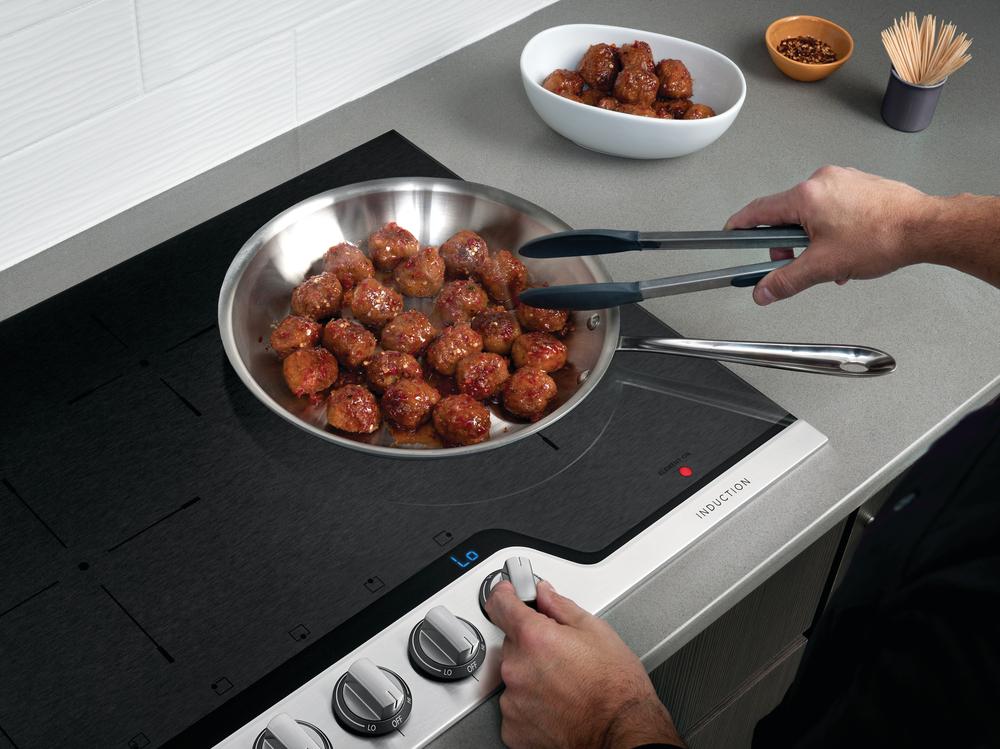 Credit: Frigidaire Professional home cook uses Frigidaire Professional induction cooktop to sear meatballs