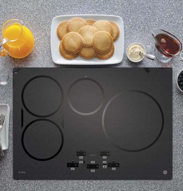 Credit: GE Profile product image of GE Profile induction cooktop with breakfast ingredients