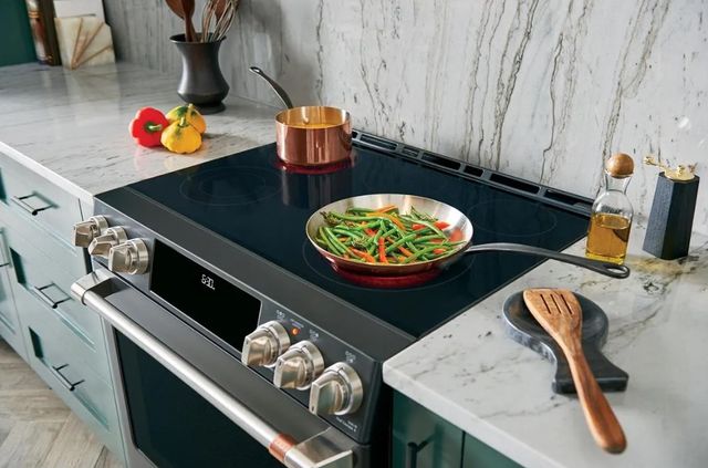 Front view of a Cafe slide in range in a modern kitchen