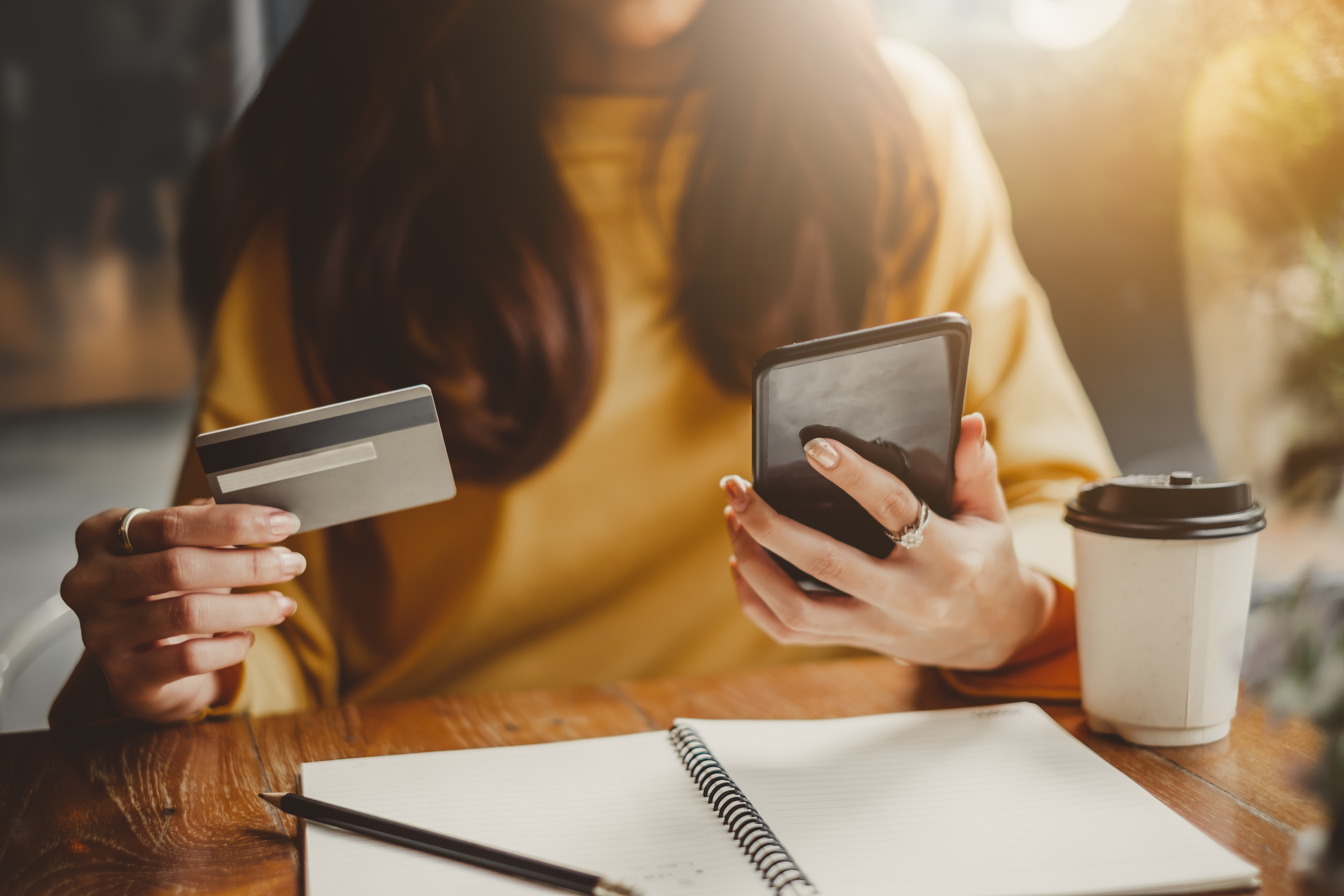 young-beautiful-asian-woman-using-smart-phone-and-credit-card-for-shopping-online-in-gm