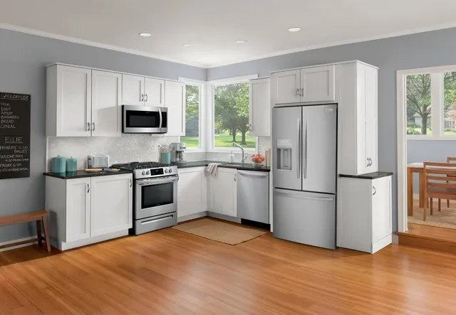A Frigidaire FRFC2323AS French door refrigerator in a kitchen 