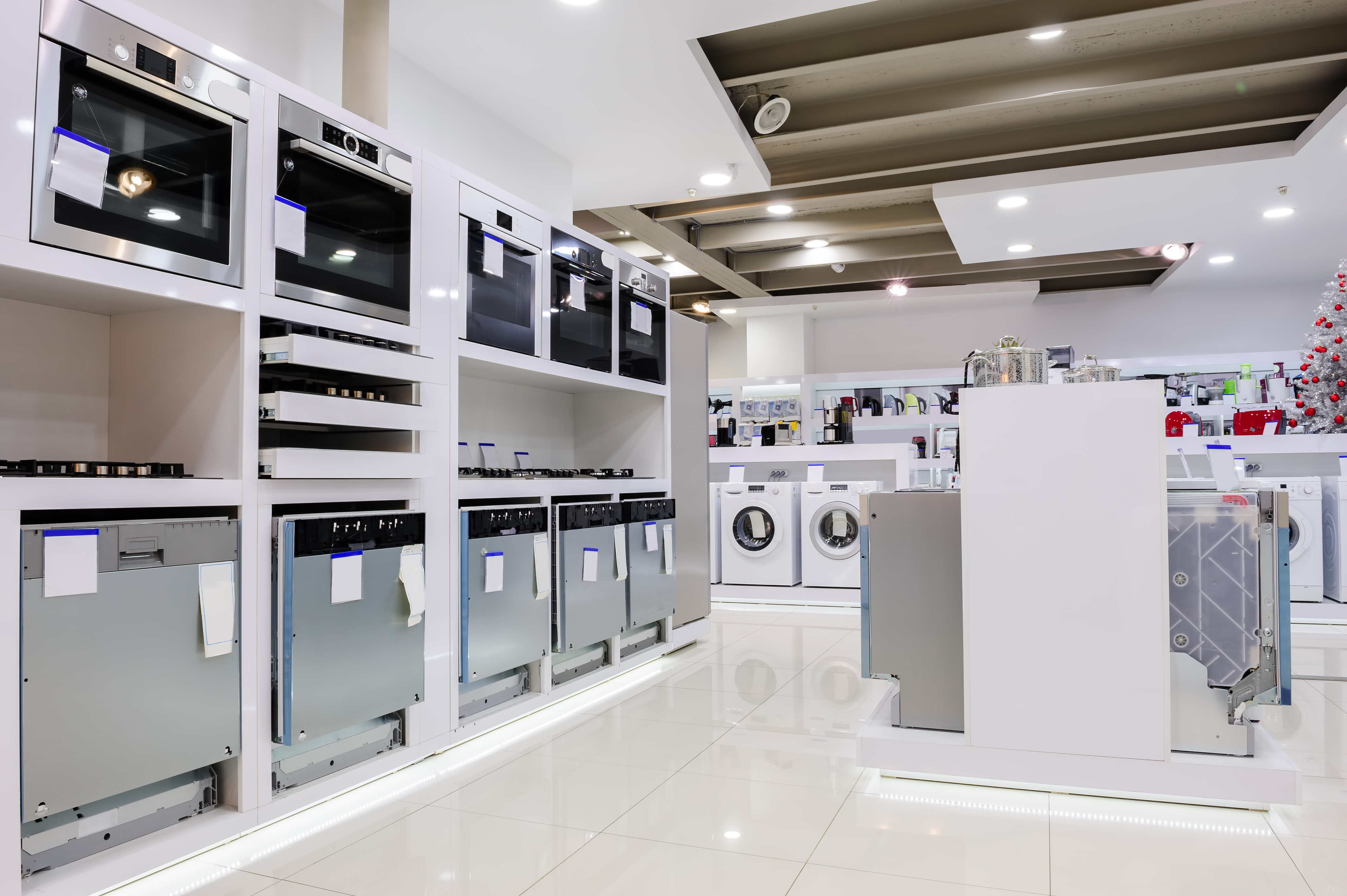 An appliance showroom with a variety of ticketed appliances 