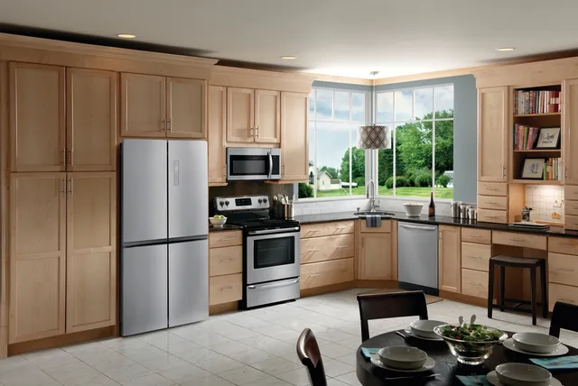 The Frigidaire FRQG1721AV stainless steel French door fridge in a kitchen with matching Frigidaire appliances