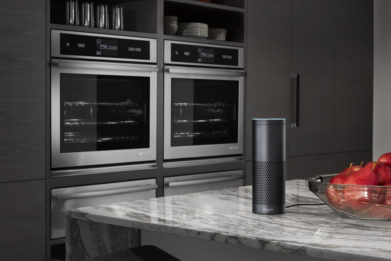 A wide shot of two KitchenAid smart ovens and an Alexa smart device Credit: KitchenAid A wide shot of two KitchenAid smart ovens and an Alexa smart device
