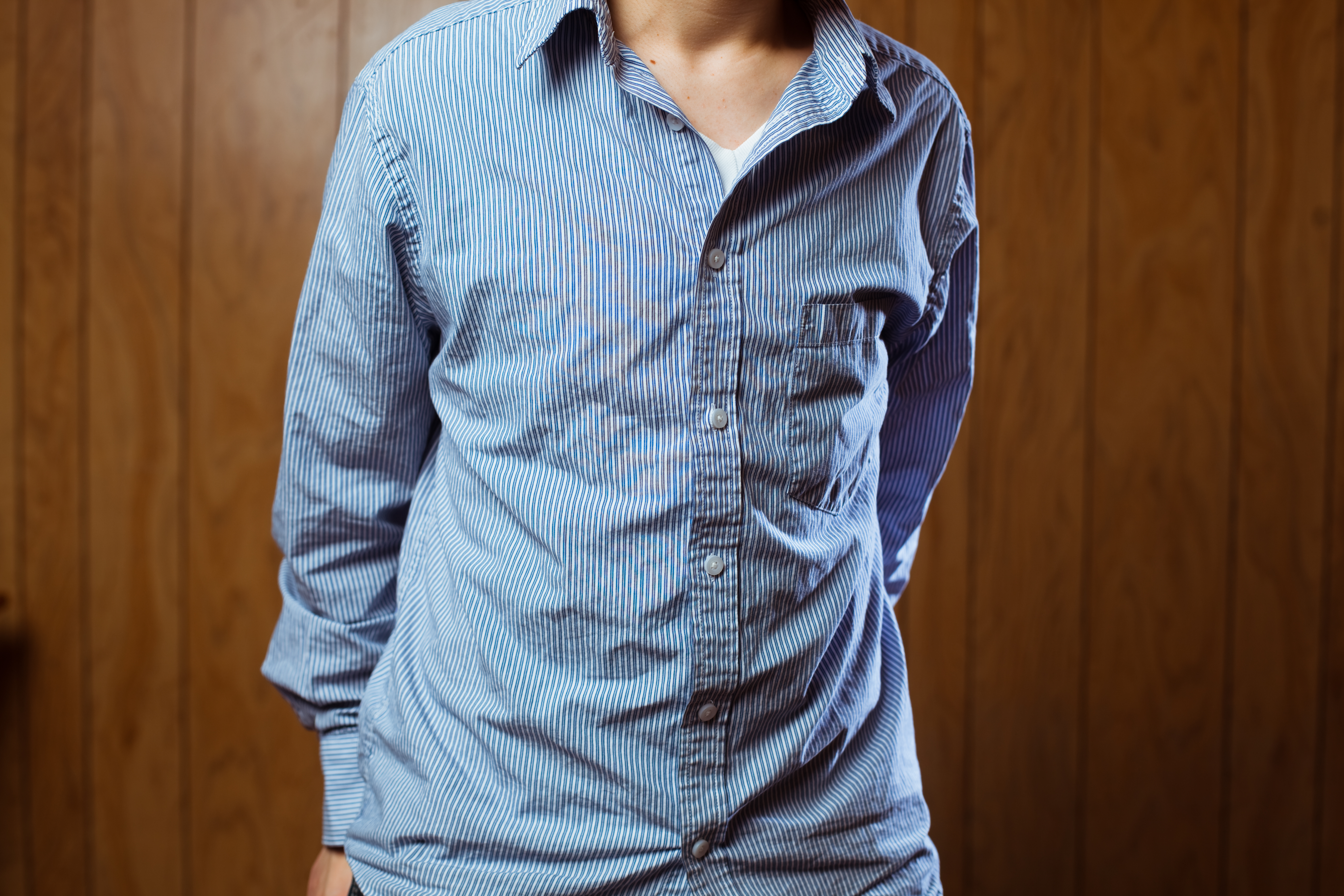 iStock Credit: timnewman Shot of person in wrinkled blue pinstripe button up shirt