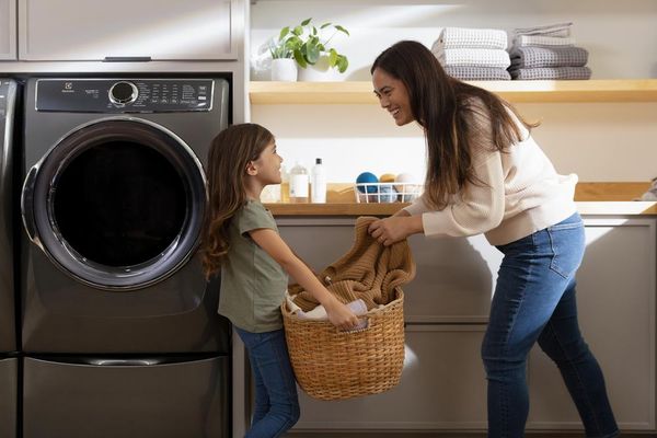 Mother and Daughter Washing Clothes