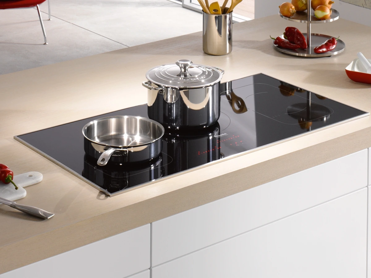 The Miele KM 6377 induction cooktop with cookware Credit: Miele The Miele KM 6377 induction cooktop with cookware