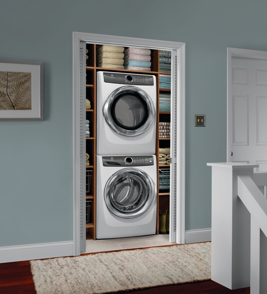 lifestyle image of electrolux EFLS527UIW tacked washer and dryer