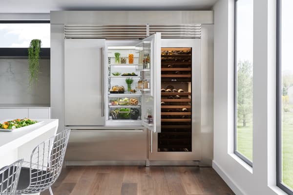 A Sub-Zero 48” built-in French door refrigerator with a matching wine cellar