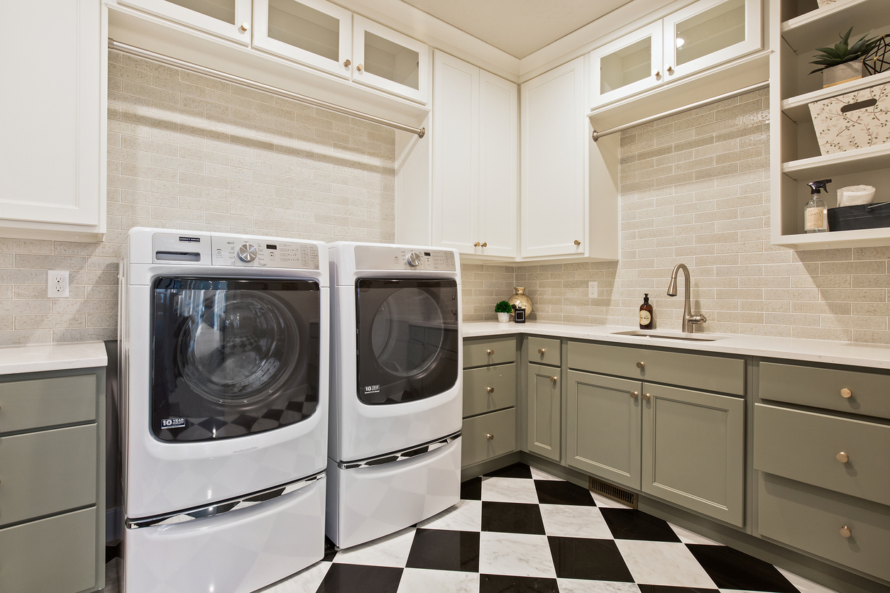 front-load washer and dryer pair with laundry pedestals