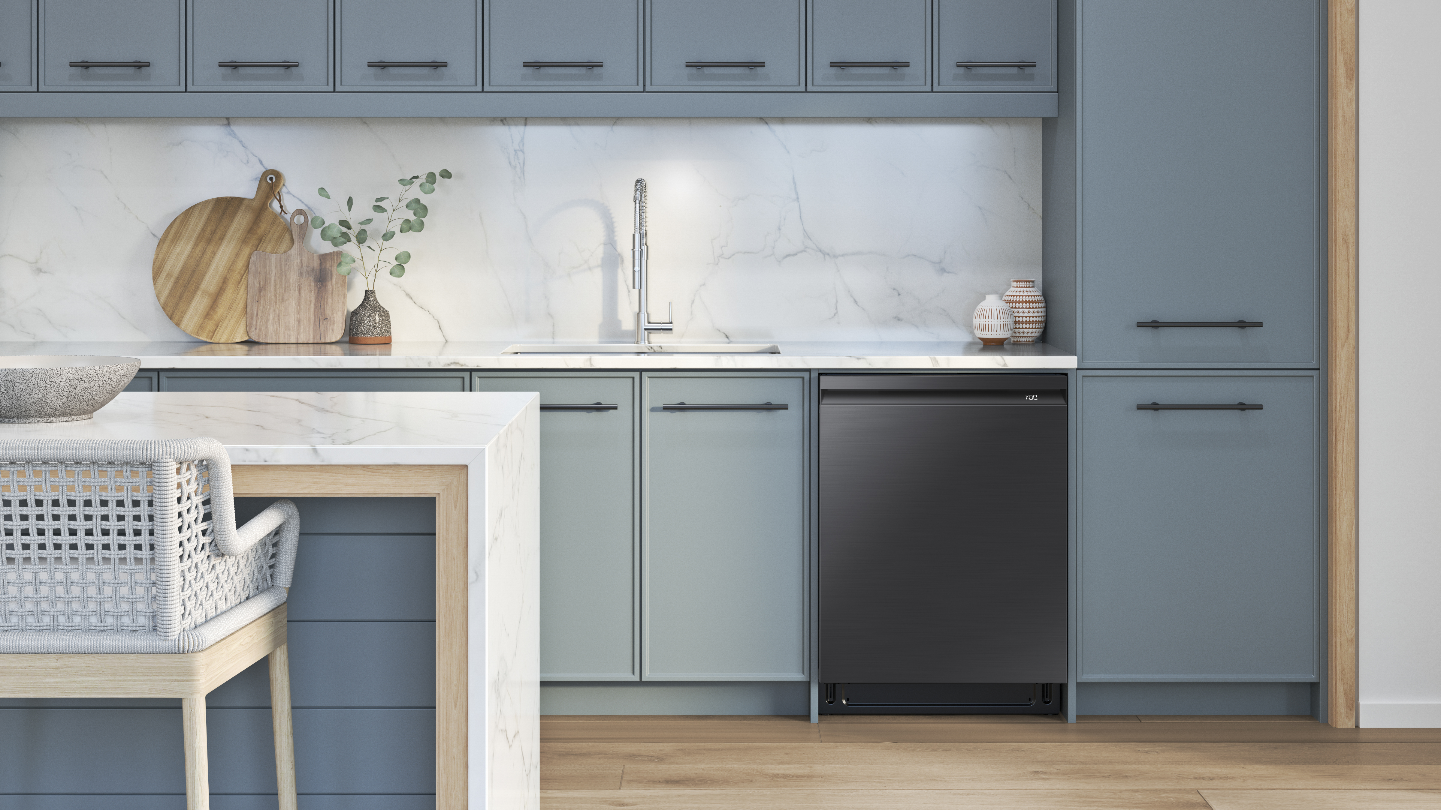 A Samsung black dishwasher featured in a kitchen with blue cabinets 