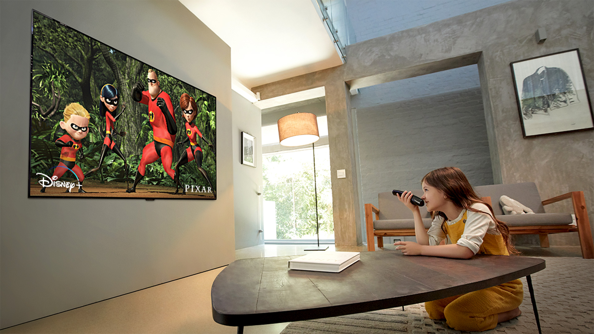 Young girl sits and watches Disney’s The Incredibles on LG OLED TV 
