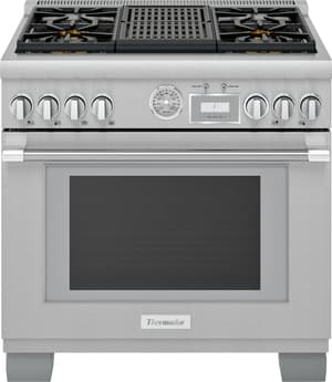 Stainless steel Thermador brand range with large handle and metal griddle in the middle. 