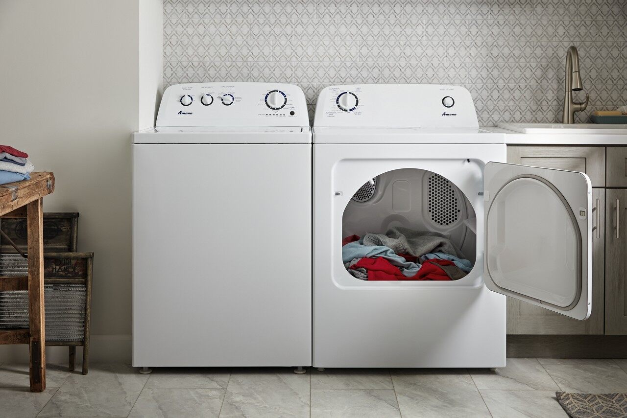 Credit: Whirlpool A laundry room with a matching Whirlpool top load washer and dryer