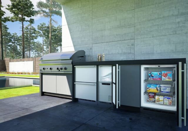 Credit: U-Line Front view of a modern outdoor kitchen with an opened outdoor refrigerator