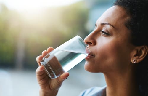 Woman Drinking Glass of Water