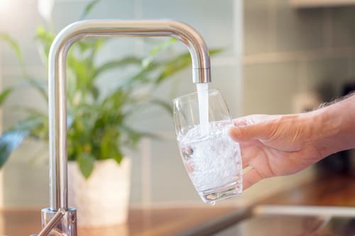 Water Filling Glass From Faucet