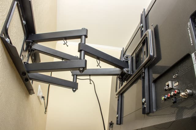 TV mounted above fireplace