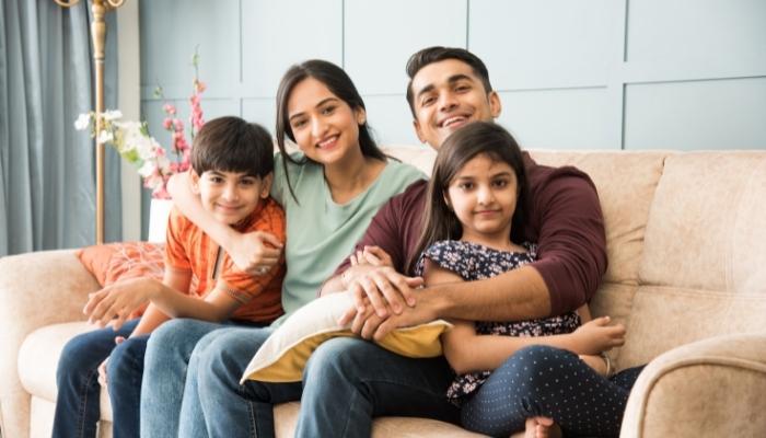 Happy family sitting on couch