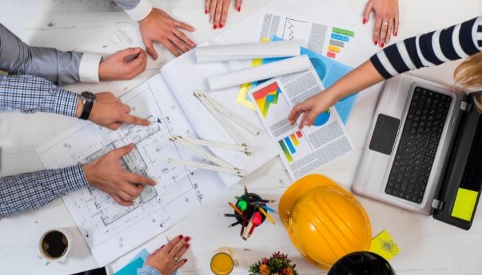 CI_Plan-Your-Smart-Home-Custom-Solution_2.jpg People creating plans and blueprints