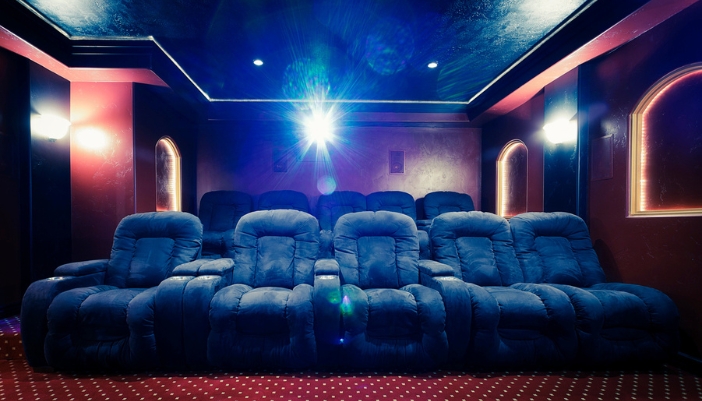 CI_Projector-Installation-Types_2.jpg A home theater with a projector in a box behind the theater