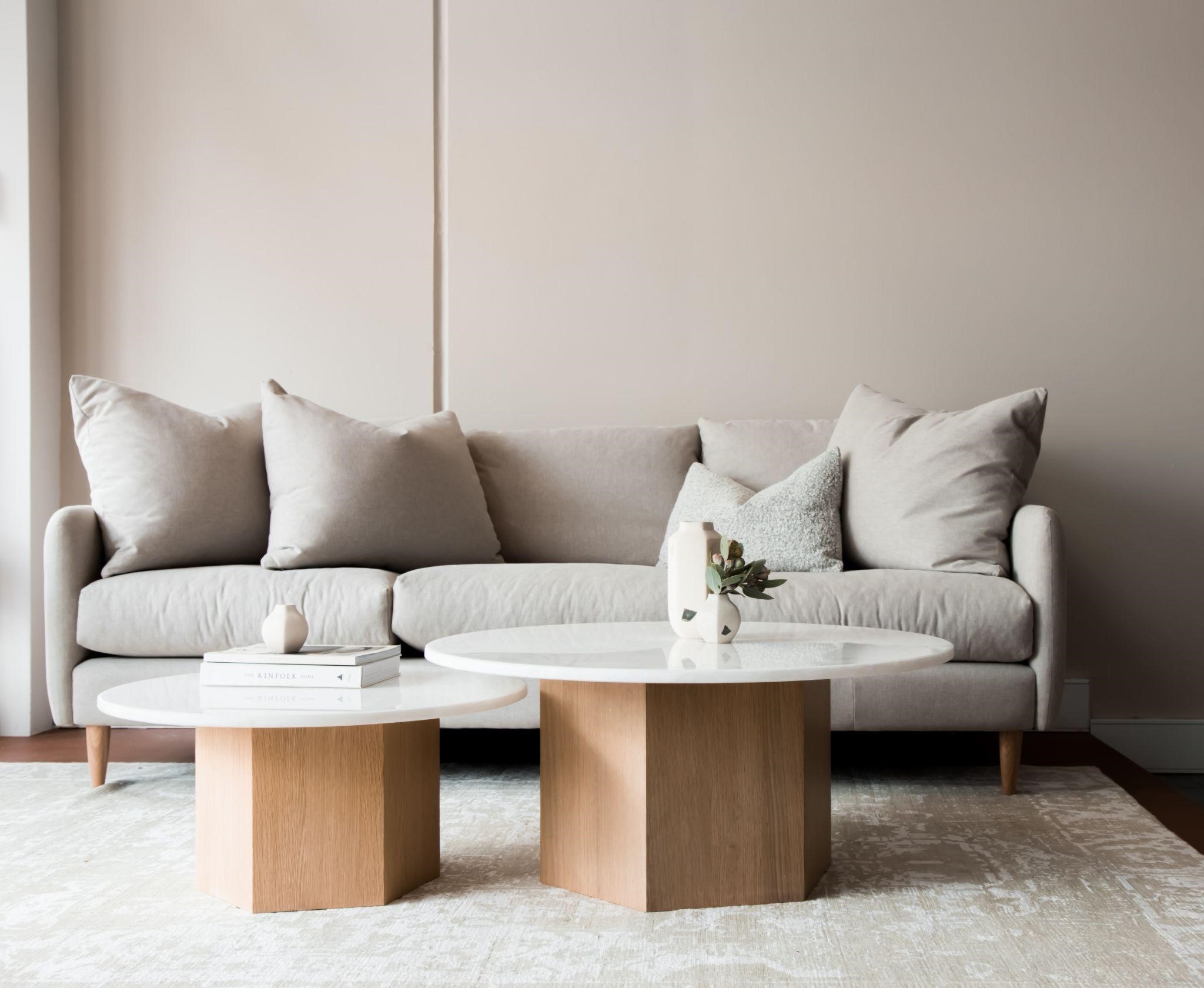 Neutral shade sofa with geometric coffee tables