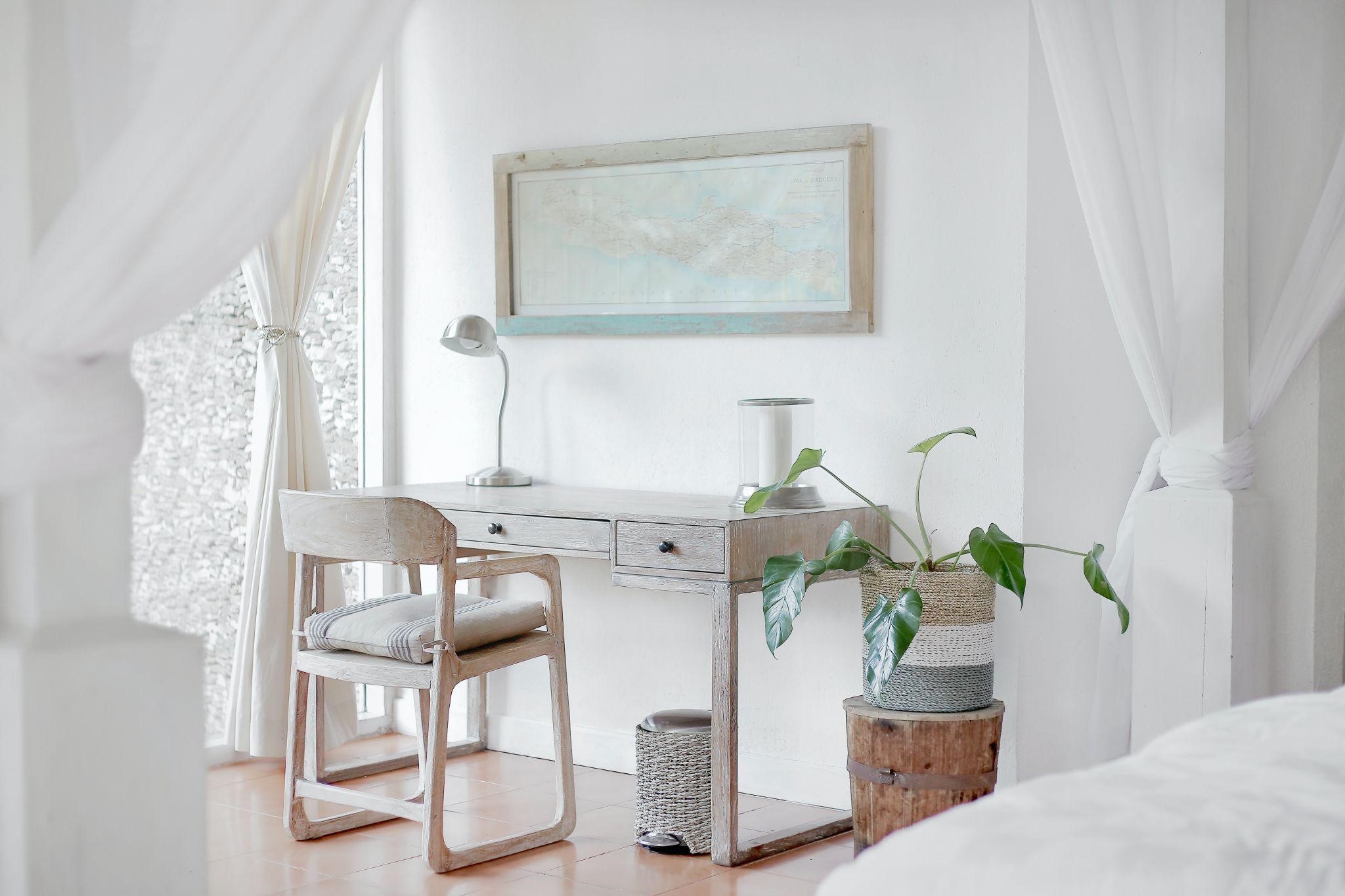 Small desk area with natural materials and a potted plant