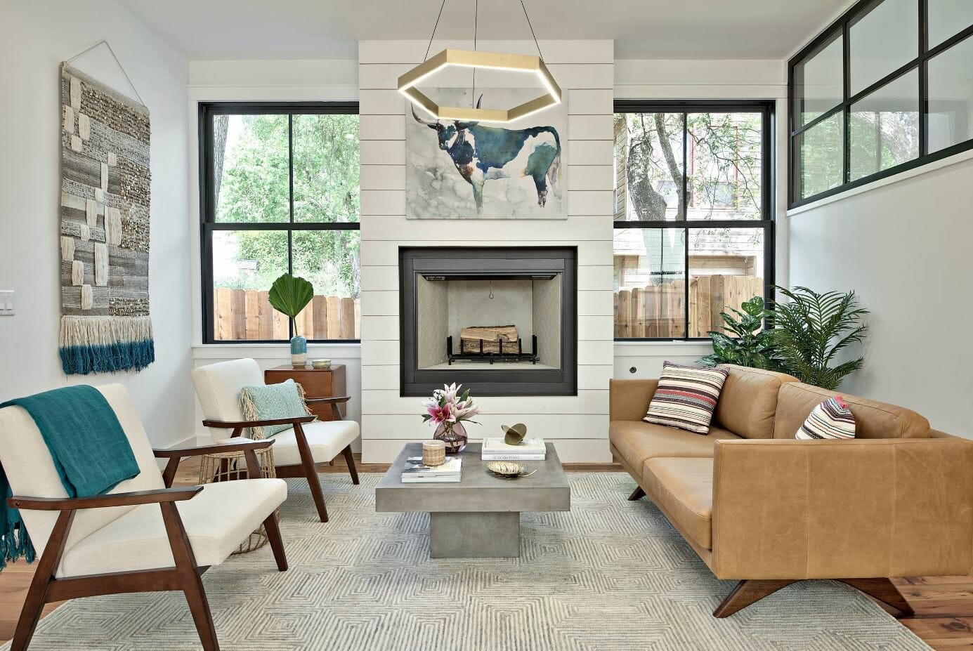 View of farmhouse-inspired living room with a sofa and loveseat