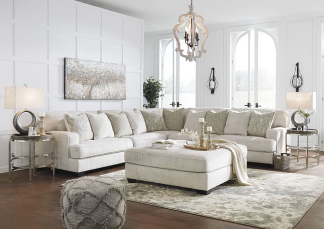 A large white sectional sofa in an open living area A large white sectional sofa in an open living area
