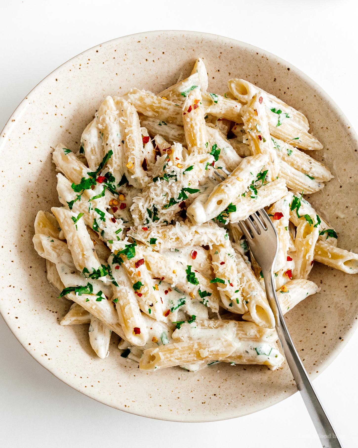 Credit Source: I Am a Food Blog Overhead shot of creamy Boursin pasta in a speckled bowl