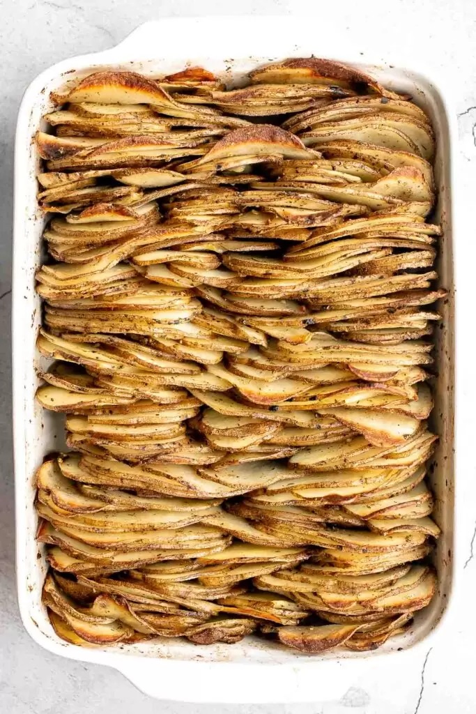 Credit Source: Ahead of Thyme Overhead shot of casserole full of roasted gratin-style potatoes