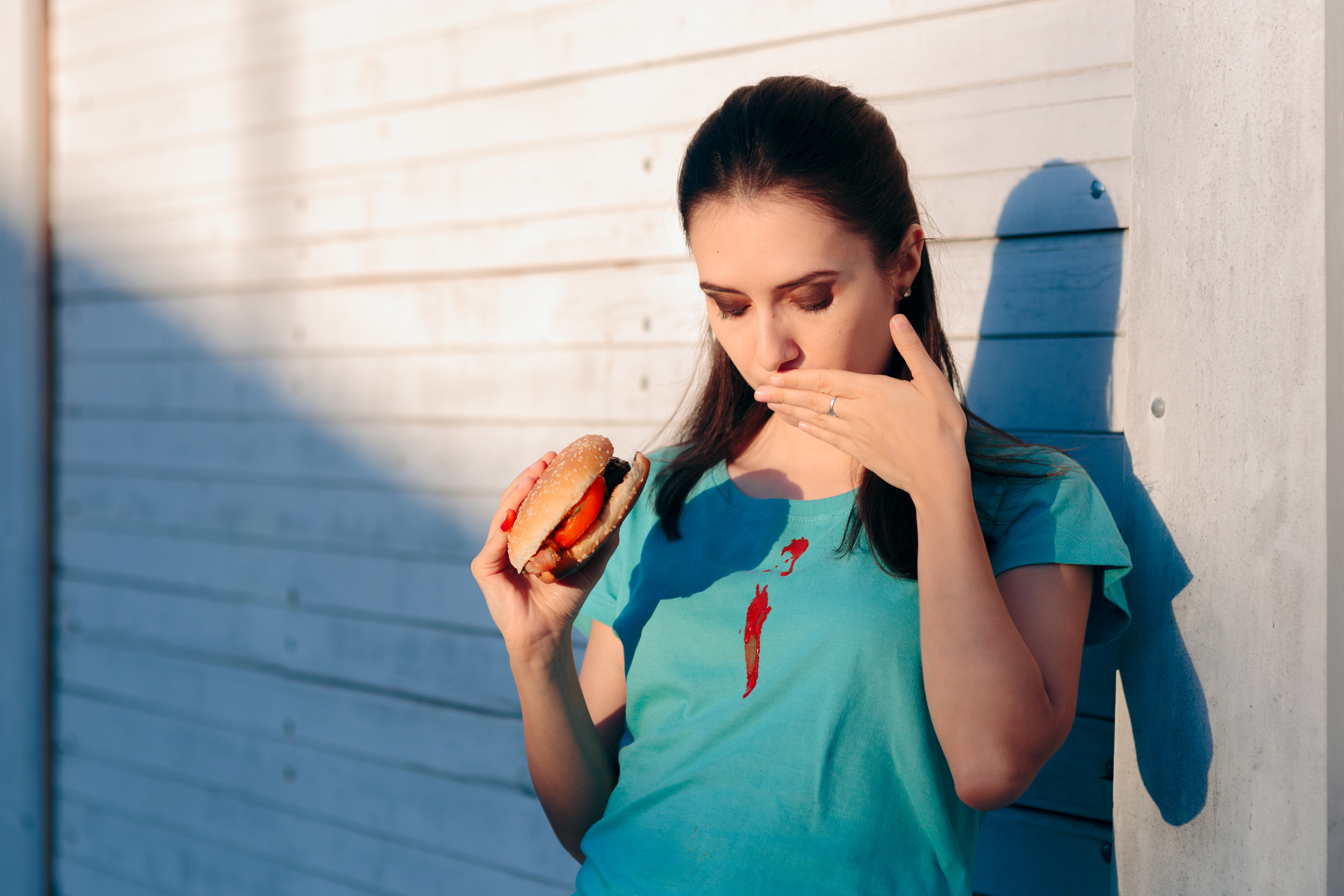 nicoletaionescu woman spilling ketchup on her shirt