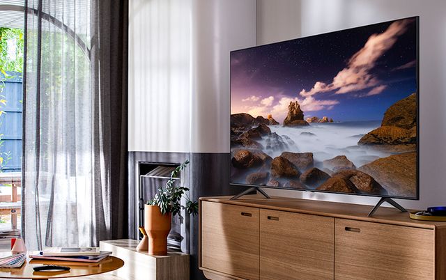 Samsung QLED TV in a bright, sunlit living room