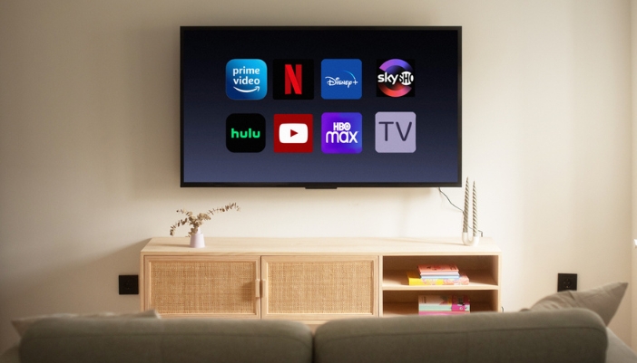 A flat screen TV featuring streaming services on the screen.