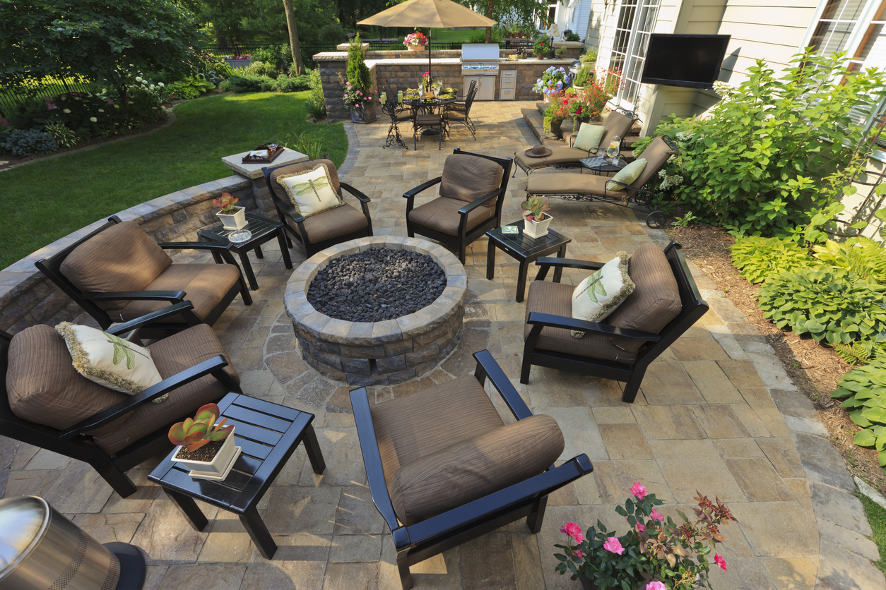 iStock Credit: TimAbramowitz backyard gardens and patio with outdoor tv from an elevated view