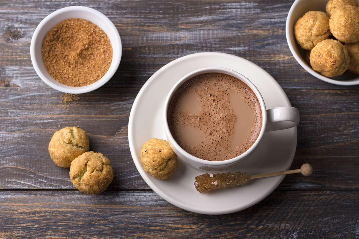 iStock Credit: OlgaLepeshkina snickerdoodle cookies with cinnamon and nuts, hot chocolate on wooden background