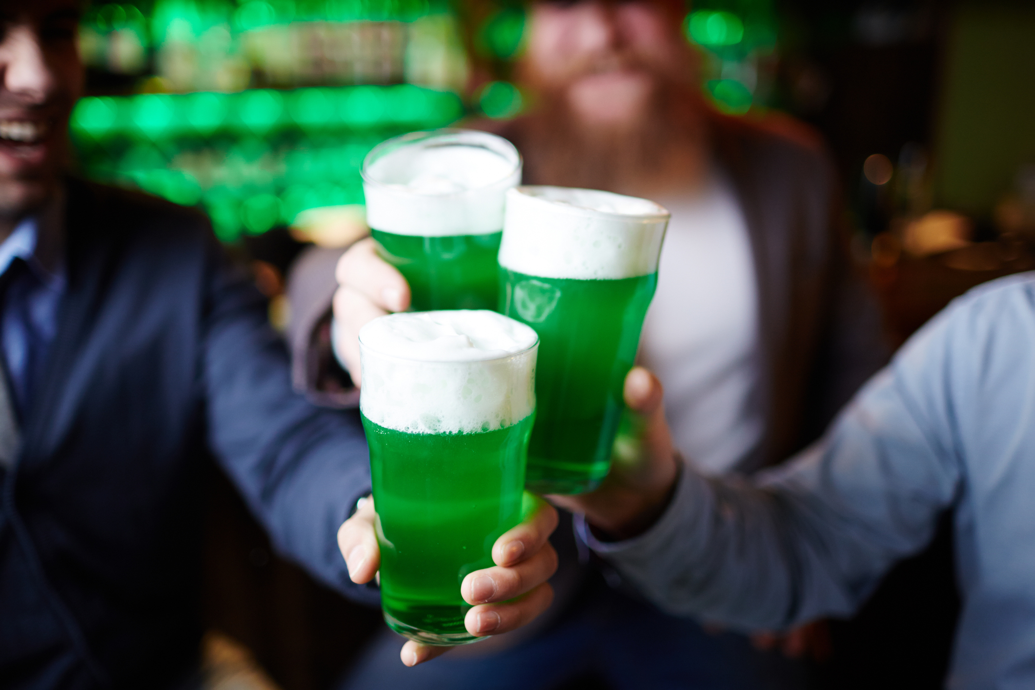 shironosov cheersing a pint of green beer