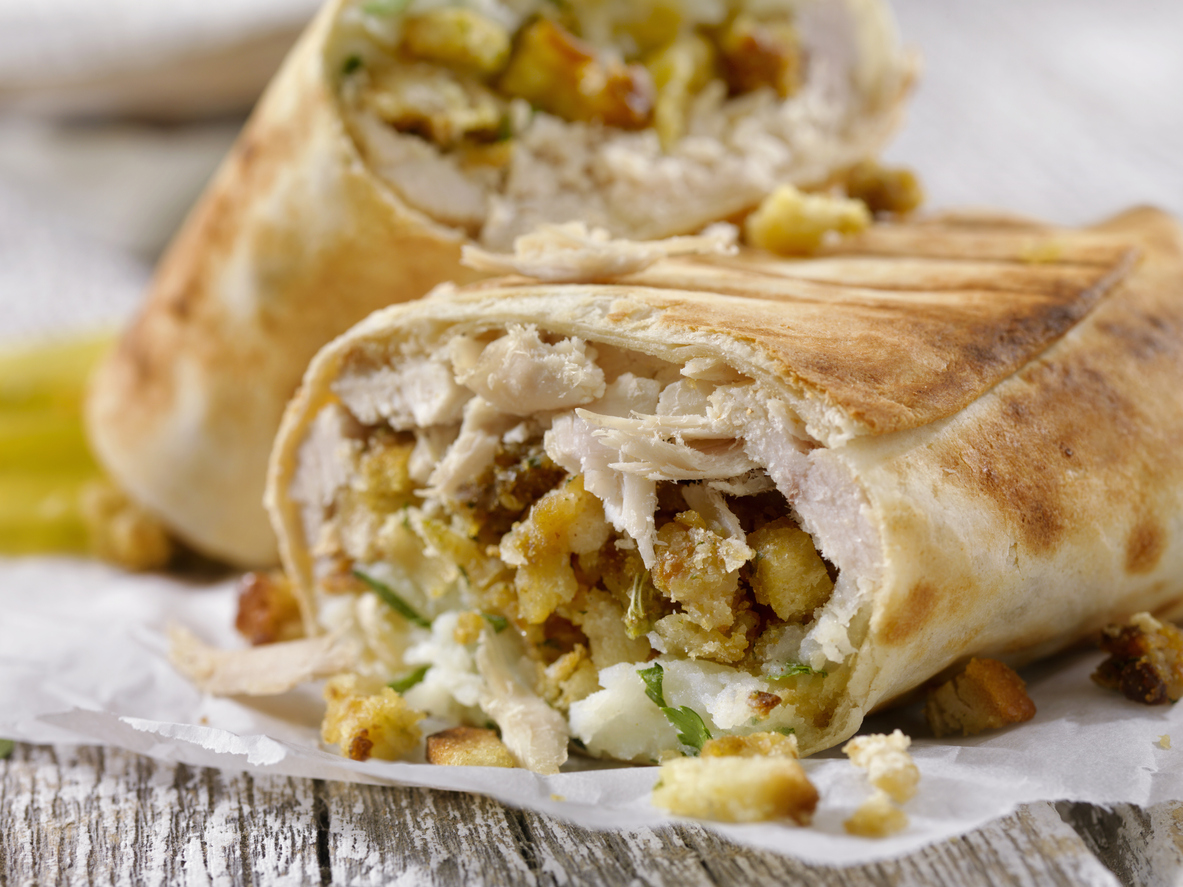 iStock Credit: LauriPatterson leftover turkey dinner burrito with turkey, stuffing, mashed potatoes, and gravy