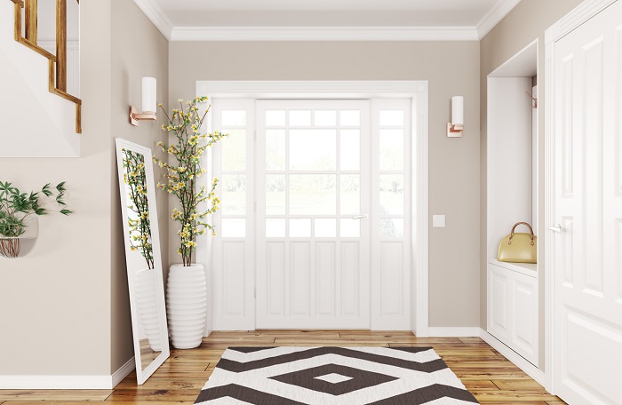 Interior design of modern hallway with doors and staircase.