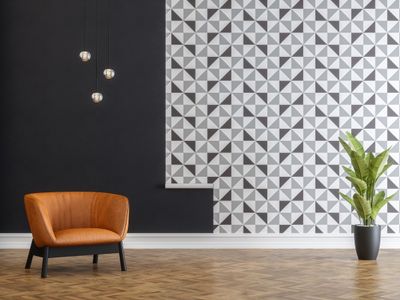 A leather chair against a geometric background 
