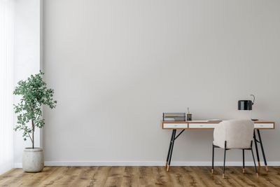 A minimalist, modern home office with furniture and décor 