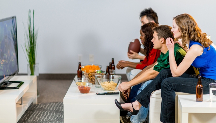 Furn_Game-Day-Furniture_3.jpg Friends watching football with a convenient coffee table and side table