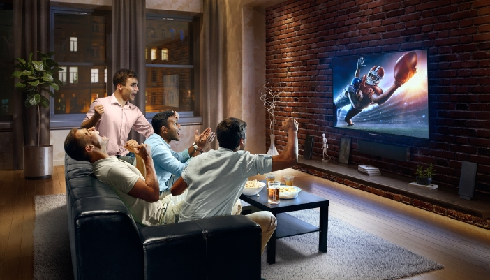 Furn_Game-Day-Furniture_5.jpg Group of friends watching football in the living room