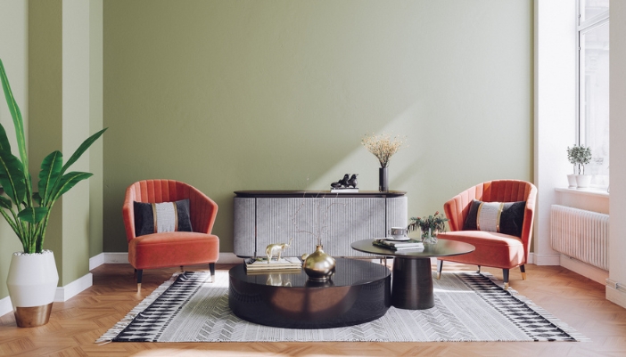 A retro inspired living room with pastel wingback chairs.