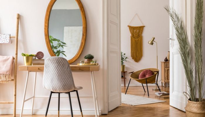 Boho style vanity table with plants and mirror