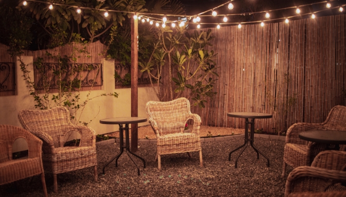 Furn_outdoor-furniture-summer-guide_2.jpg A back patio with string lights